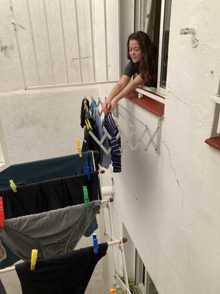Hanging laundry saves time and money over a dryer